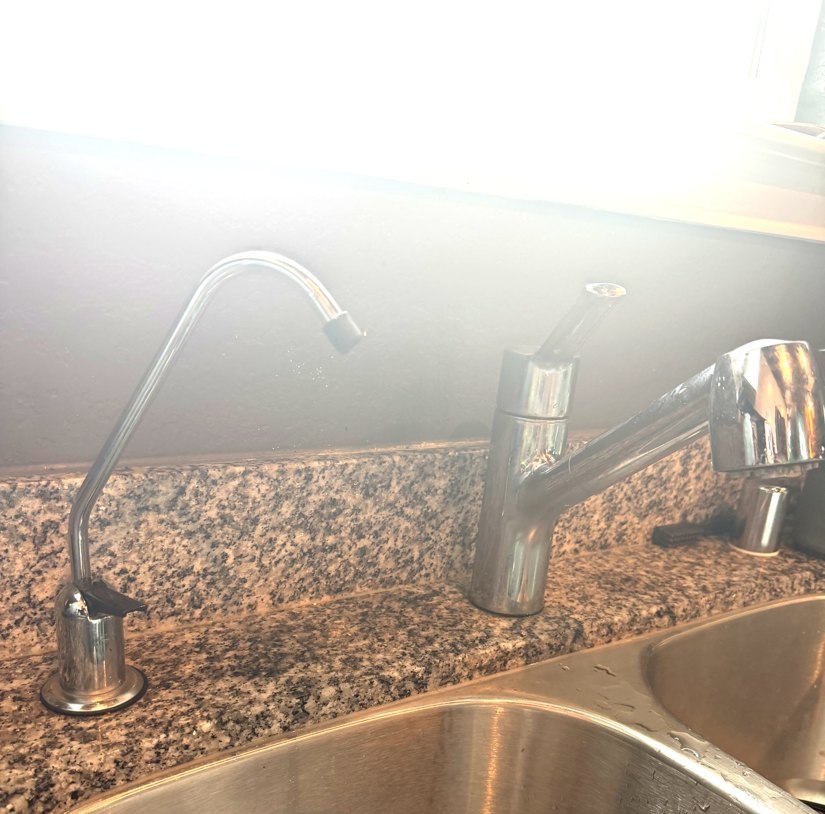 Kitchen sink with a dedicated filtered alkaline water tap